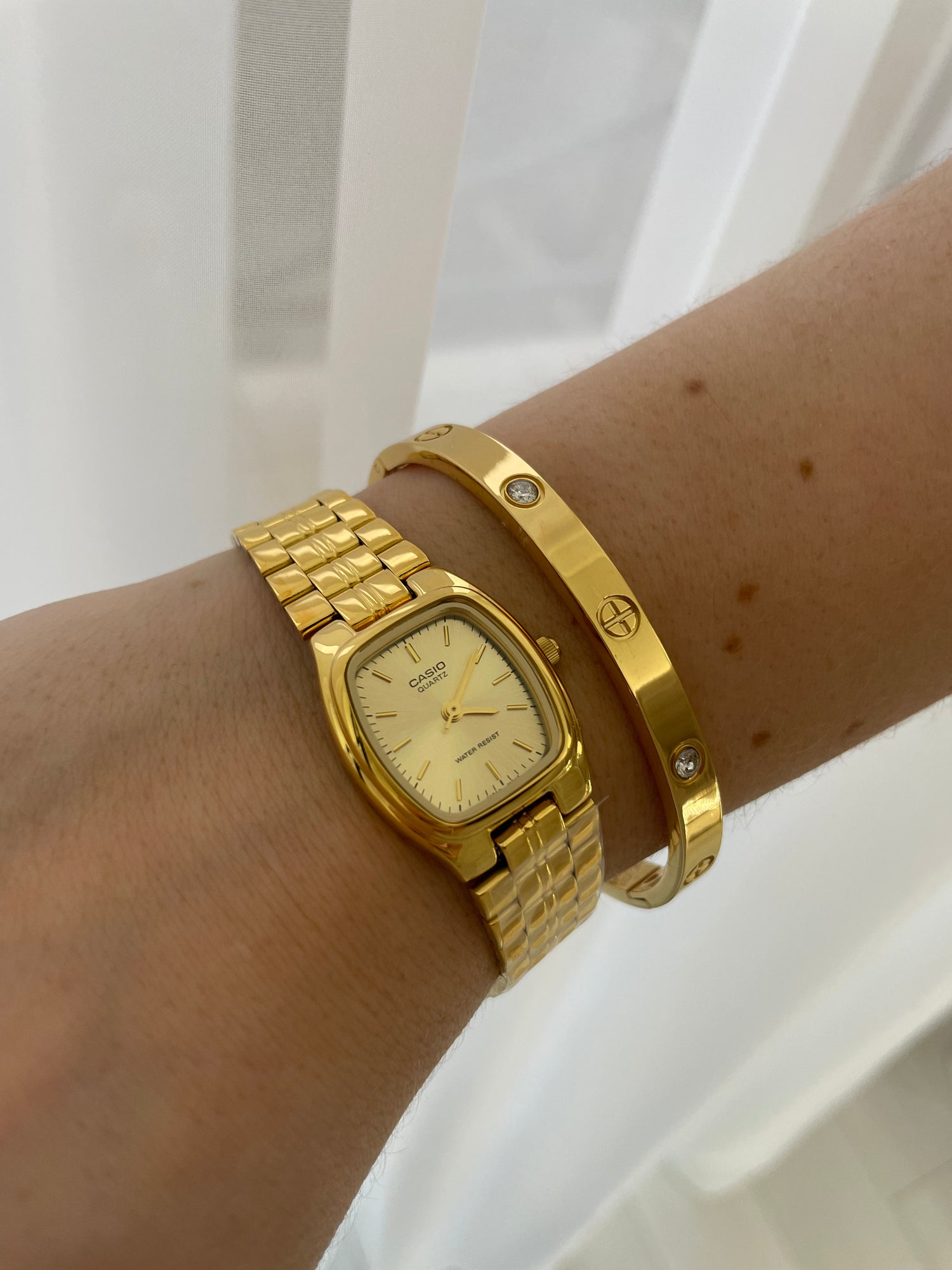 Montrein store. Casio gold watch and an elegant gold bracelet